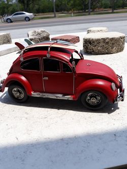 Full metal table top VW bug with surfboards on top