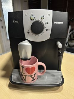 Coffee Machine Saeco Fully Automated Coffee And Espresso Maker, grinds and brews. 