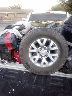 17s  mid use Toyota Tacoma tires and rims all 4 evenly