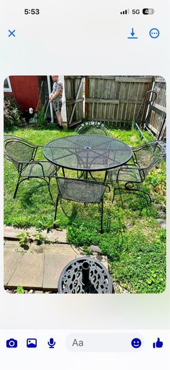 Wrought iron patio set, table size is 48 inch diameter