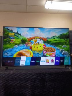 55 inch LG 4k smart TV ultra HD beautiful tv comes with remote control shows great quality clear picture works perfect guaranteed