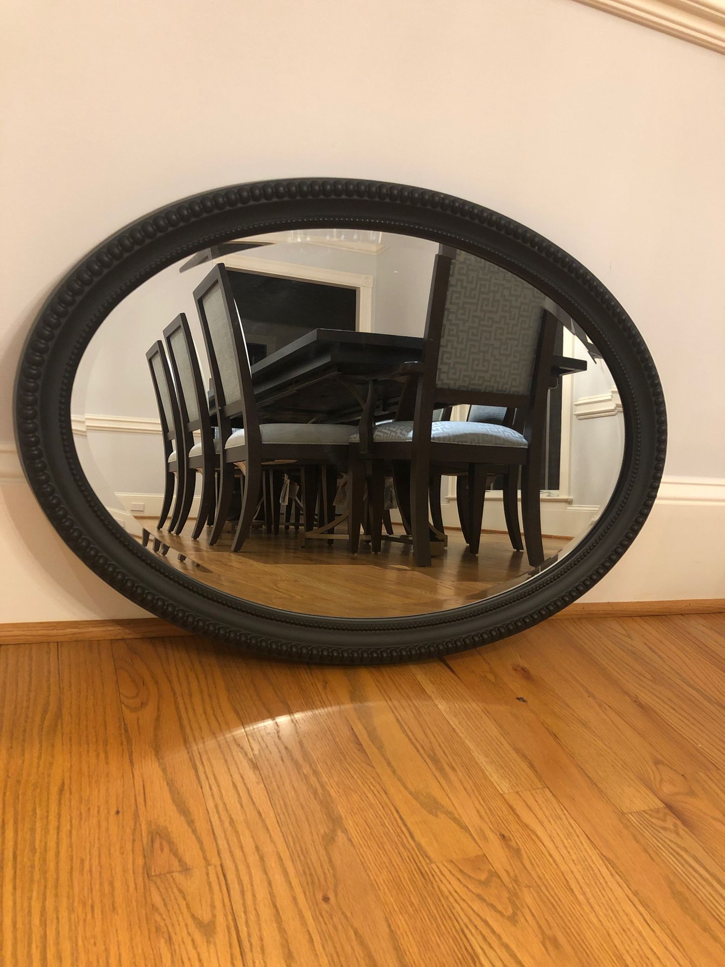 Oval black frame mirror