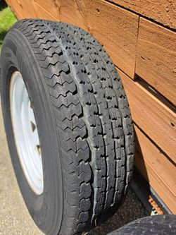 Trailer rim. Tire old, but hold air. Good for short trips 45 obo
