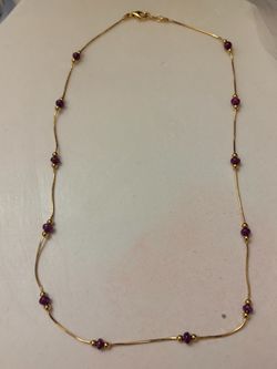 14 kt gold necklace w ruby accents