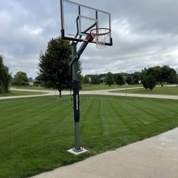 Goaliath 54 inch in ground basketball hoop, adjustable basketball court 