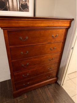 Brown Wood Five Drawer Dresser  Size (LxWxH): 40” x 20” x 54”