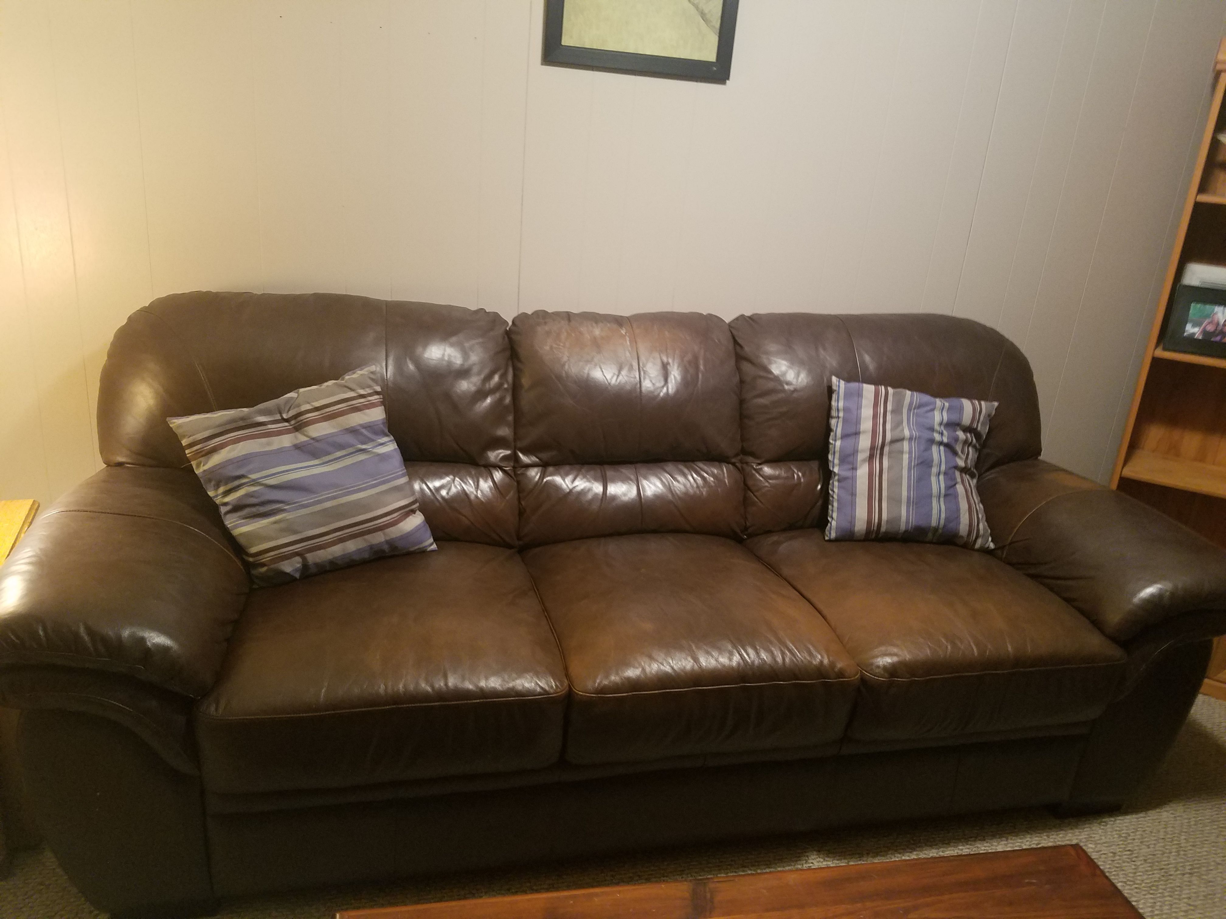 Brown leather sofa. Very solid. Got a newer sofa. Will be available for pickup next weekend. Serious inquires only please!