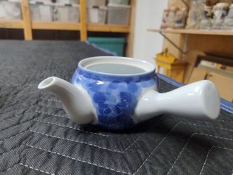 Blue and White Ceramic Teapot with Floral Design