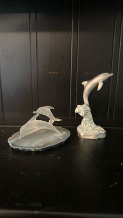 Pewter and glass dolphins