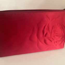 Lancôme cosmetic makeup bag. Red satin with a raised rose on it. 11 inches wide, 6 inches tall and 3 inches width. 