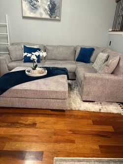 Sectional couch, living room with ottoman