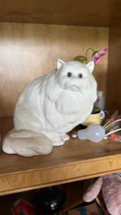 Hollow white ceramic cat