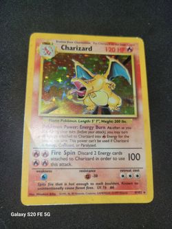 Charizard 1999 card has some used damage