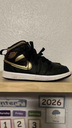 Air Jordan’s 1 black, gold, white