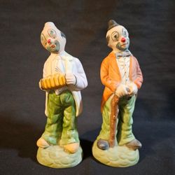 Ceramic Hobo Tramp Clown Figurines Walking Cane Accordion 8" Tall This product is a set of two 8" tall ceramic hobo tramp clown figurines, each holdin