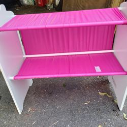 A Little Girl Stand With Shelfs