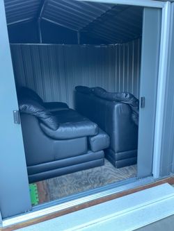 Two leather love seat couches