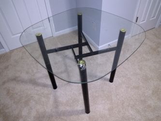 Glass kitchen dining table for sale.