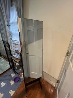 Full length mirror with jewelry storage