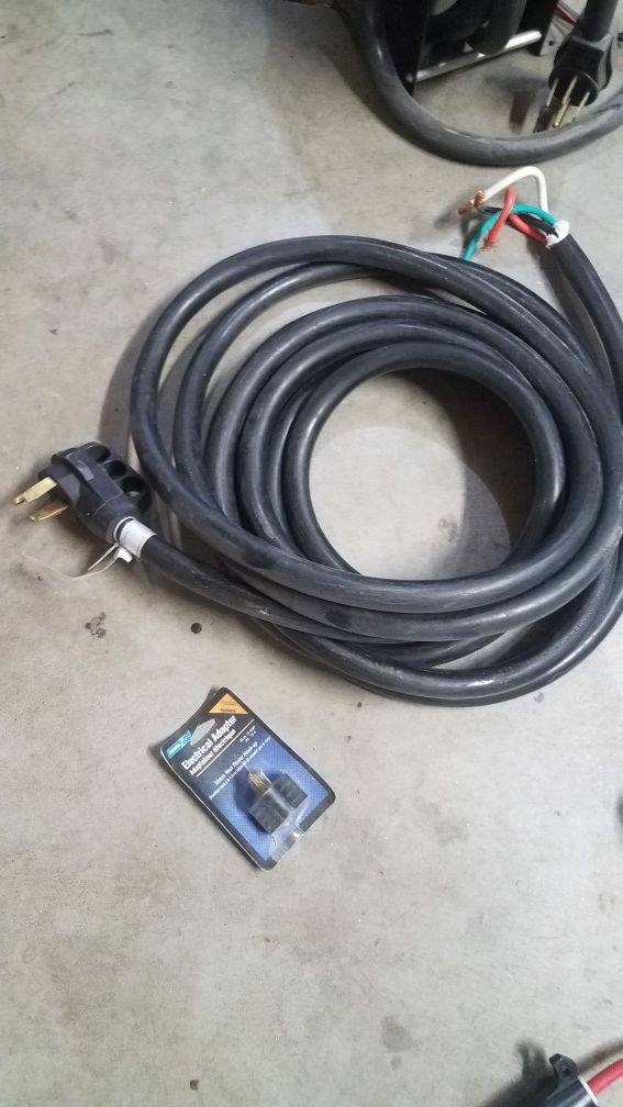 Rv 50 amp powered cord reel and 50 amp cord for Sale in Frederick, CO