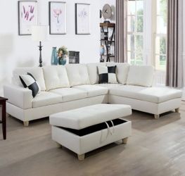 White leather sectional couch and ottoman
