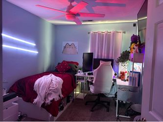 Twin XL bed frame with mattress. White gaming desk.