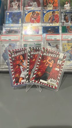 2026 Panini Net Marvels trio Trae Young Noa Essengue Carter Bryant