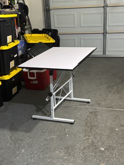 Adjustable drafting table/desk