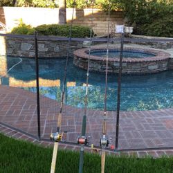 Three Saltwater Fishing Rods with Reels