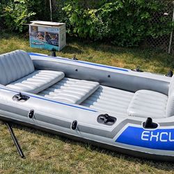 Excursion 5 person inflatable boat set with paddles.