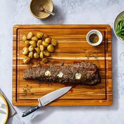 New Teakhaus Reversible XL Cutting Board with Smartphone/Tablet Cut Out. Costco price $70 plus tax.