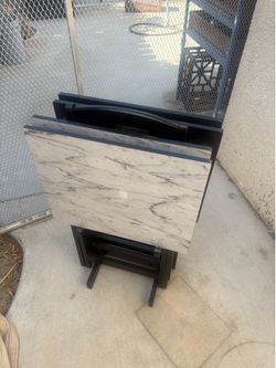 Set of 4 folding tables on a Rack. Mint Condition. $20