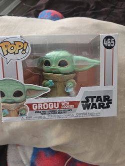 Selling grogu pop look closely it has some scratches on it bent