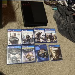 PS4 with eight games all chords cleaned it out PS4 dust free
