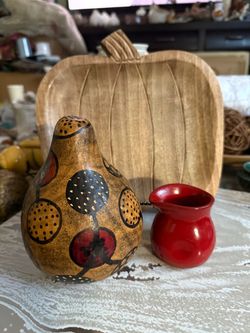 Wooden Pumpkin Tray / Dish / Decor Approx 8.5” x 9” Wooden pumpkin-shaped tray is made of light-toned wood with carved details and non-slip pads on t