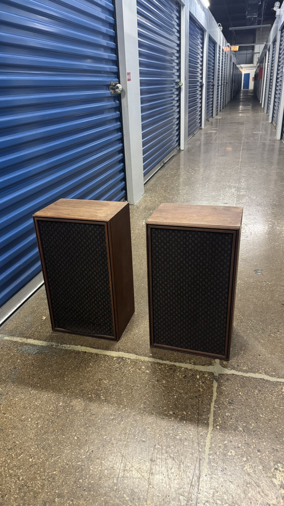 vintage 1970s speakers in dark walnut finish with black mesh