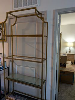 Gold tone Etagere and wall mirror