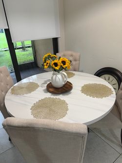 Marble table on wood pedestal