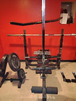 Phoenix Olympic HB 500 work out bench with accessories.