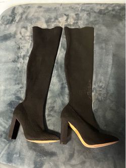 Black skinny knee high hells.