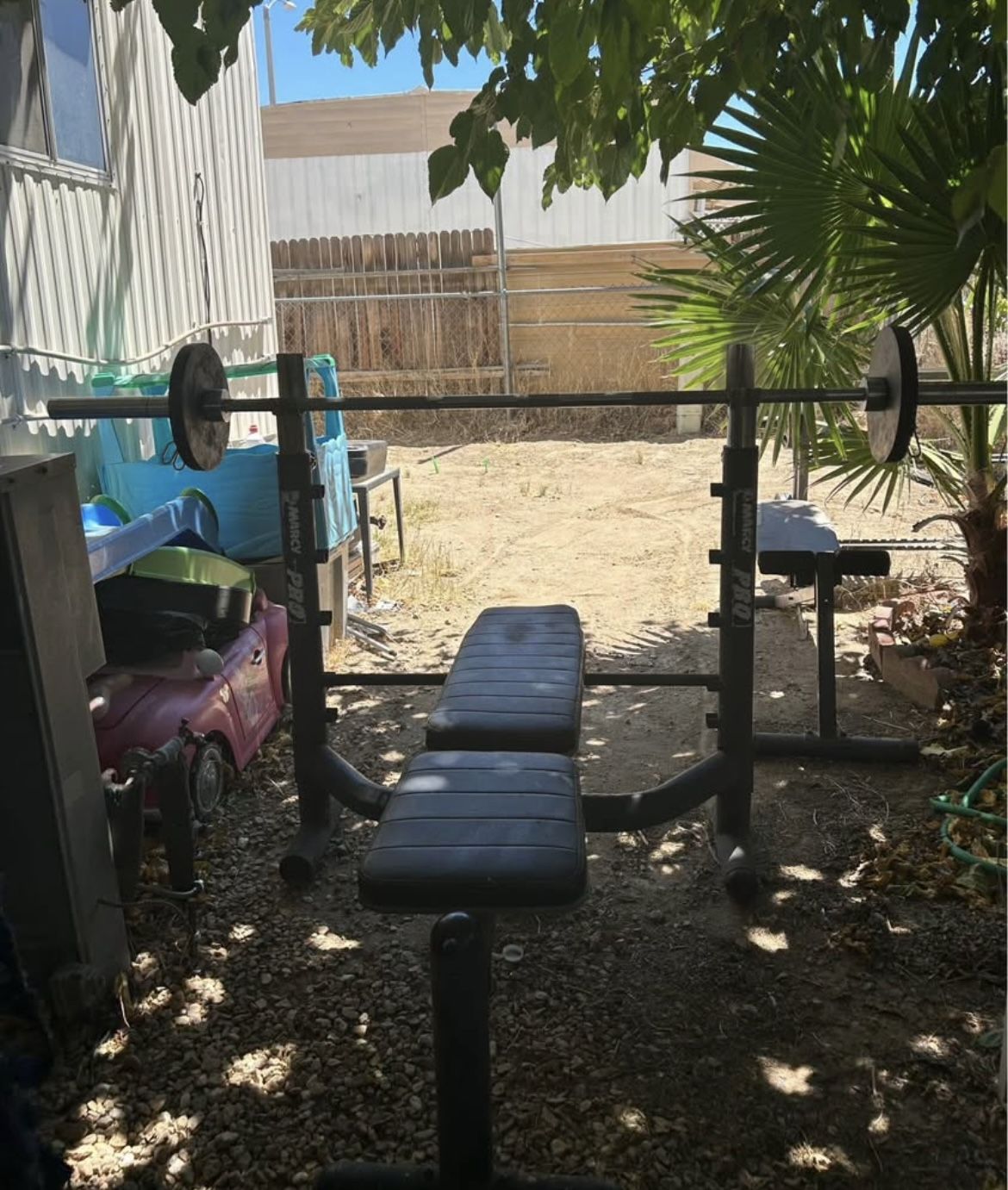 Olympic bar, weights, and bench 🏋️♀️🏋️