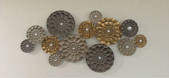 Metal gold and silver medallion wall art