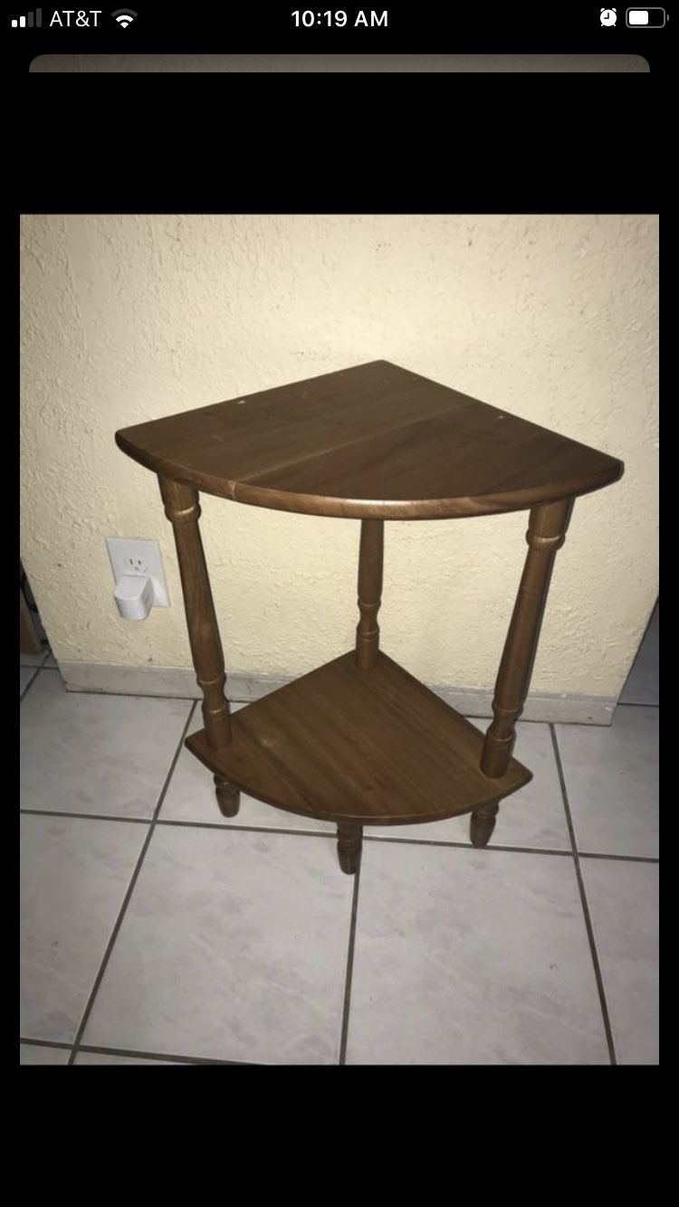 Small wooden corner shelf / plant stand. Small holes in top from missing rail $15