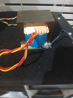 Heavy-duty laminated core power transformer removed from working equipment.
120V AC primary. Multiple secondary windings