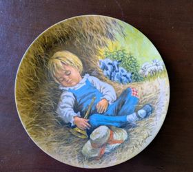This Reco International limited edition collector's plate, titled "Little Boy Blue," was issued in 1980 as part of the Mother Goose series.