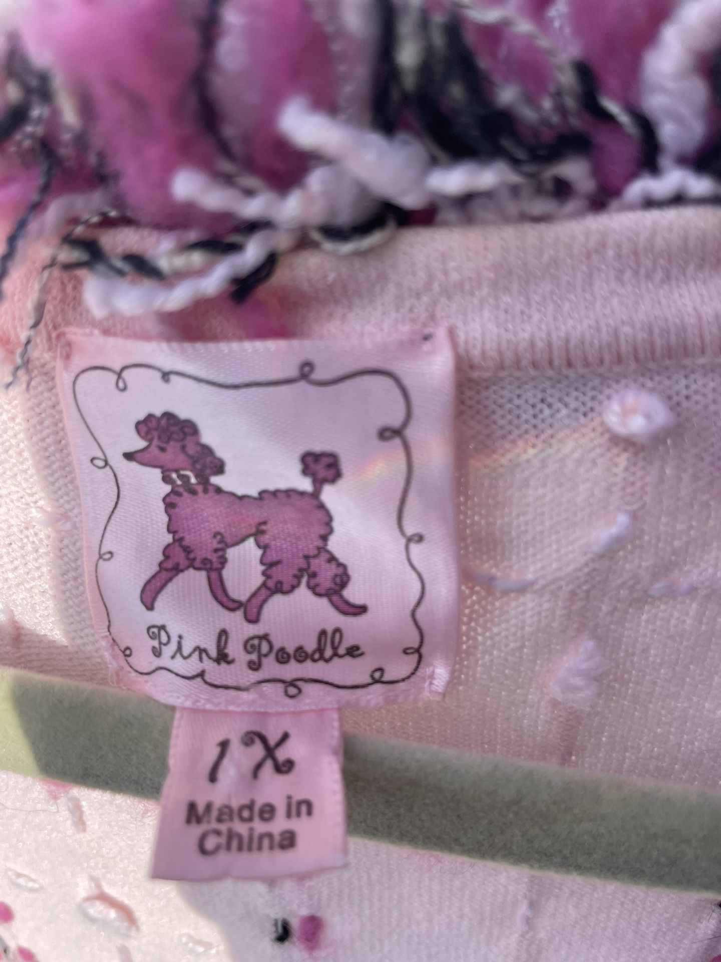 Nice sweater with poodle on it