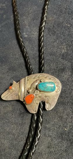 Turquoise and coral bo Lo tie made in Taos New Mexico by the Indians
