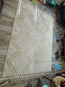 Off white and yellow area rug