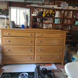 A 6 drawer dresser with mirror.