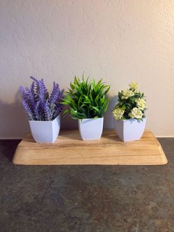 Small pots with artificial flowers